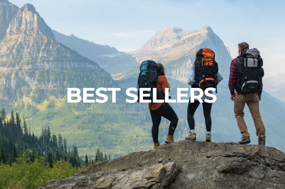 Shop Gear Favorites & Best Sellers: Image shows three hikers standing a top a stone boulder. They are facing away from the camera and are wearing TETON Sports backpacks for backpacking. They are staring at a large granite mountain in the background.
